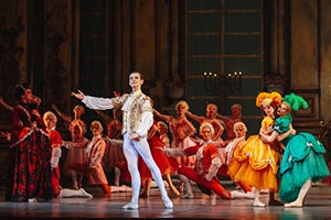 The stepsisters (right) admire the prince at the ball.